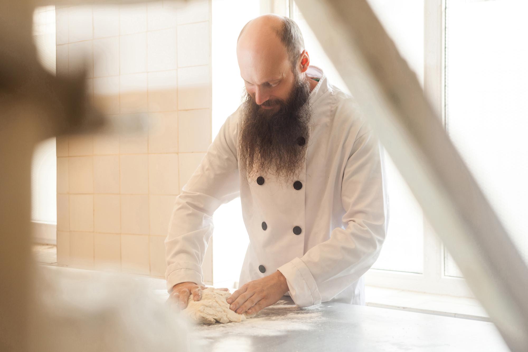 founder preparing dough in studio kitchen